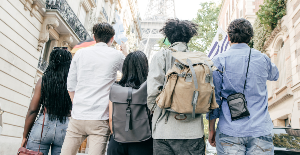 A group of responsible travelers approaching the Eiffle Tower in Paris, France.